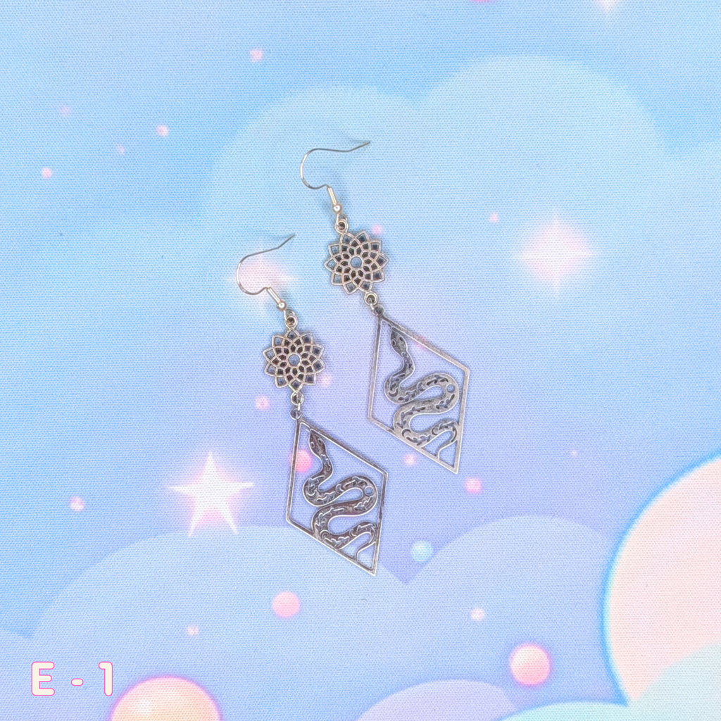 Silver Lotus Star Earrings with Snakes and Geometric Diamond Frame
